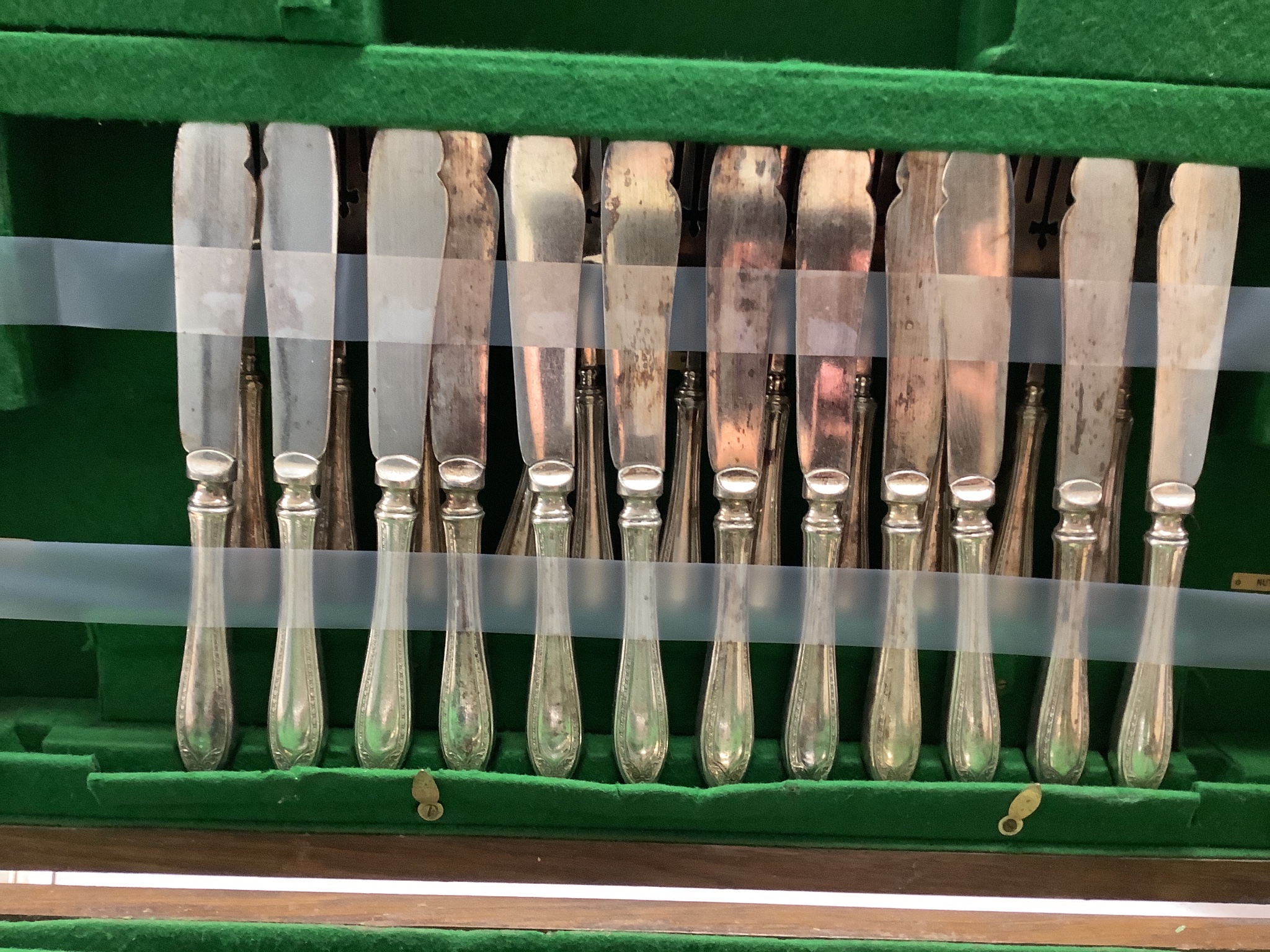 A set of three silver menu holders and a part service of Community Plate, in 1930's oak table canteen